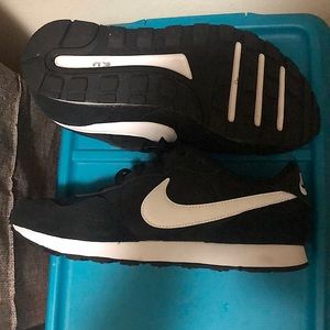 Woman’s Nike shoes. Size 7. Worn once.